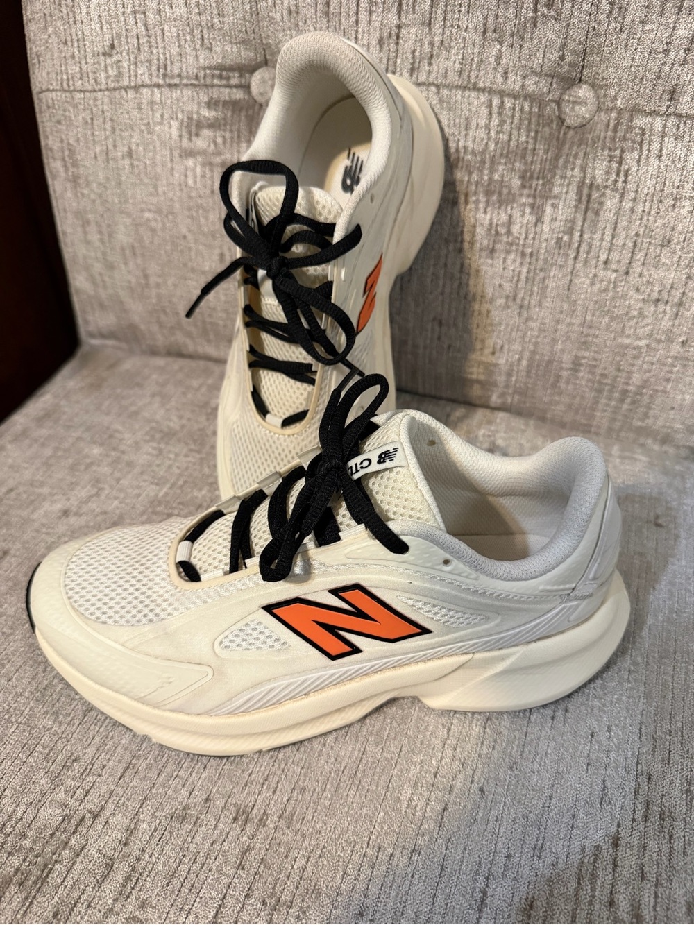 New Balance white and orange tennis shoe